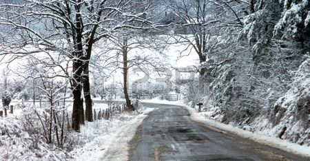 1180476-snow-covered-country-road